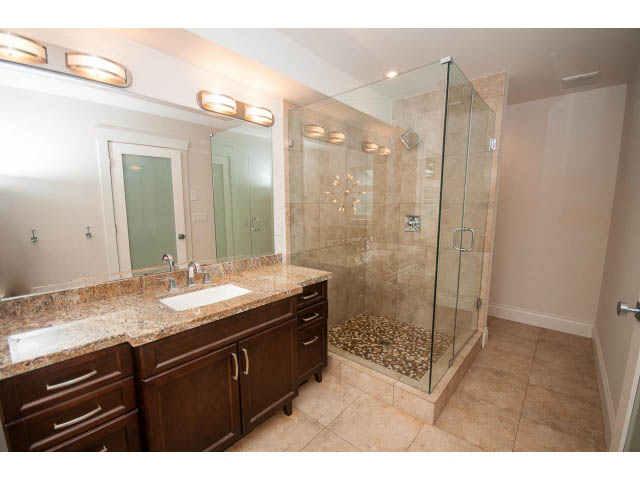 Furnished bathroom with granite countertops and glass shower enclosure. - 3476 Wellington Crescent, North Vancouver