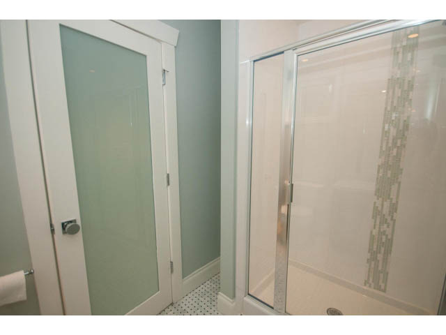 Shower with frosted glass doors, modern design. - 3476 Wellington Crescent, North Vancouver