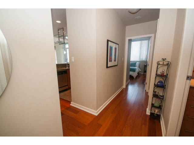 Furnished hallway with hardwood floors and a view of the living area. - 3206 - 455 Beach Crescent, Vancouver Downtown