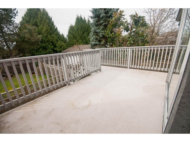 Spacious deck with white railing and steps leading down. - Upper - 113 W Kings Rd, North Vancouver