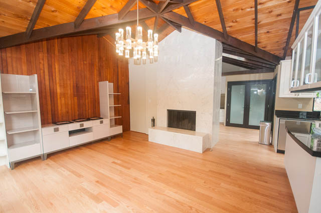 Spacious open-concept living area with hardwood floors and modern cabinetry. - 4645 Caulfeild Drive, West Vancouver