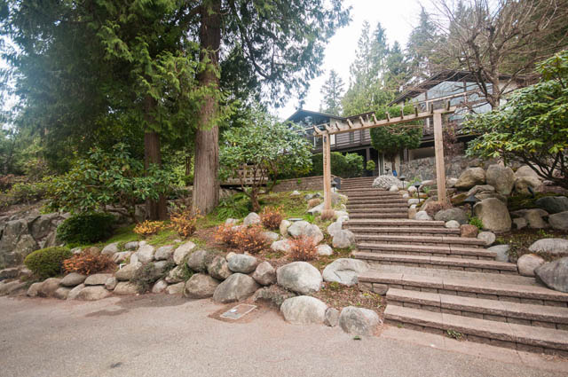 Furnished patio with stone steps and lush greenery. - 4645 Caulfeild Drive, West Vancouver