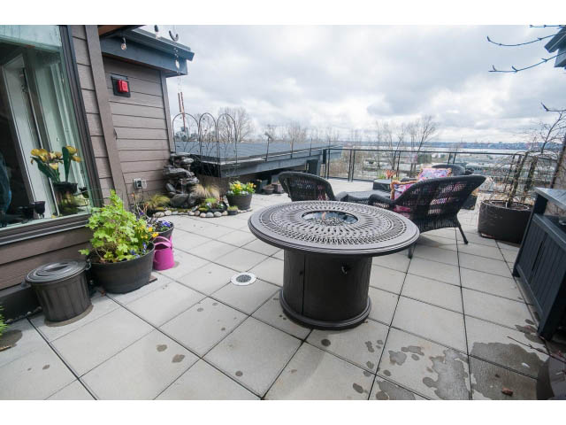 Furnished patio with outdoor furniture, city view, and potted plants. - 624 - 723 W 3rd St, North Vancouver