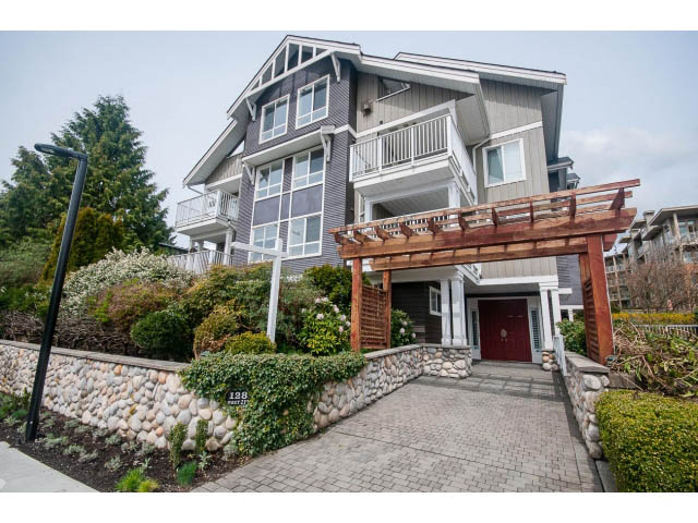 Bright 1-bedroom condo with wooden deck and stone wall. - 104 - 128 West 21st St, North Vancouver
