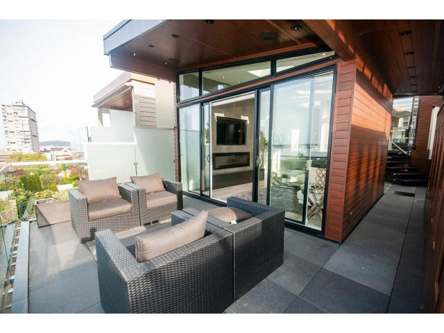 Furnished patio with outdoor seating, city view, and modern design. - 2309 Bellevue Ave, West Vancouver