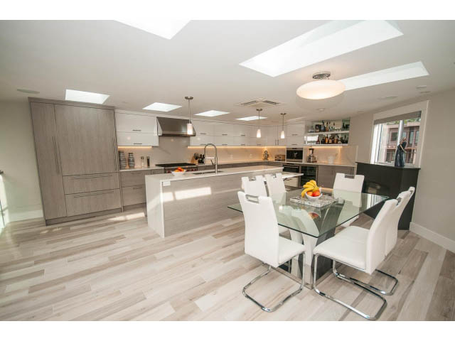 Bright kitchen with modern design, hardwood floors, and a city view. - 2309 Bellevue Ave, West Vancouver