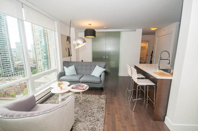 Bright living room with city view and modern furnishings. - 1003 - 535 Smithe St, Vancouver Downtown