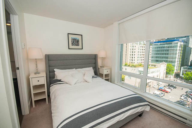 Bright bedroom with city view and modern furnishings. - 1003 - 535 Smithe St, Vancouver Downtown