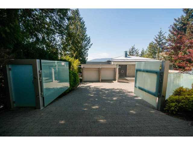 Modern entryway with glass doors and paved driveway. - 5517 Ocean Place, West Vancouver