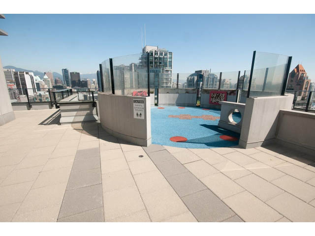 Bright rooftop patio with city view and modern furnishings. - 2606 - 1325 Rolston Street, Vancouver Downtown