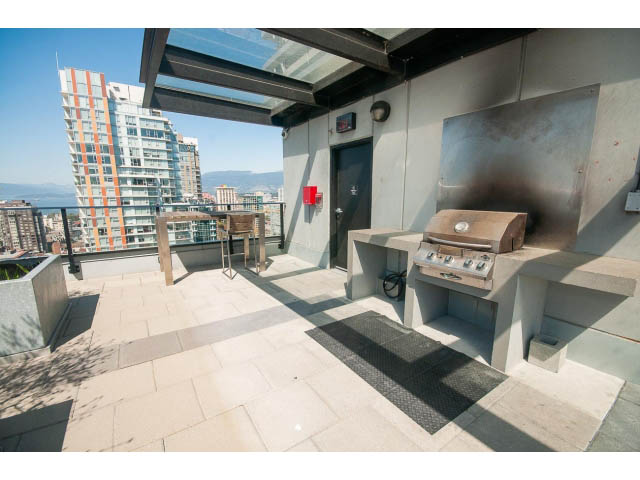 Bright rooftop patio with city view and built-in BBQs. - 2606 - 1325 Rolston Street, Vancouver Downtown