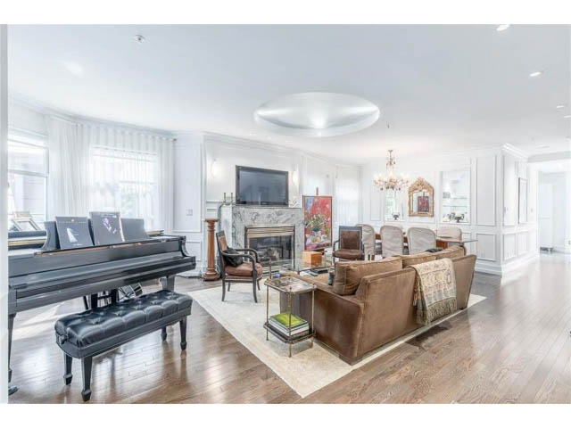 Bright living room with hardwood floors, a grand piano, and a cozy fireplace. - 1 - 2888 Birch Street, Vancouver West Side