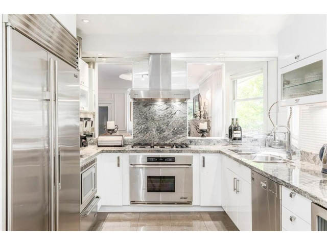 Bright kitchen with marble countertops and stainless steel appliances, modern design. - 1 - 2888 Birch Street, Vancouver West Side