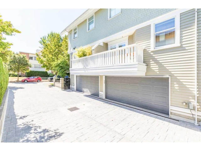 Bright and spacious living area with a balcony and a garage. - 1 - 2888 Birch Street, Vancouver West Side