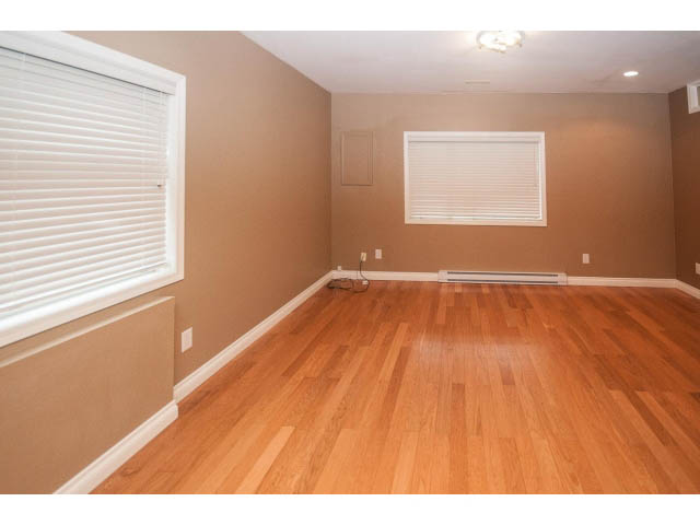 Bright living room with hardwood floors and large windows. - Upper - 5237 Timberfeild Road, West Vancouver