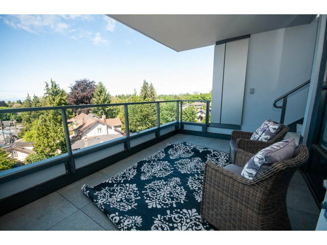 Furnished balcony with outdoor furniture and city view. - 511 - 2102 W 48th St, Vancouver West Side