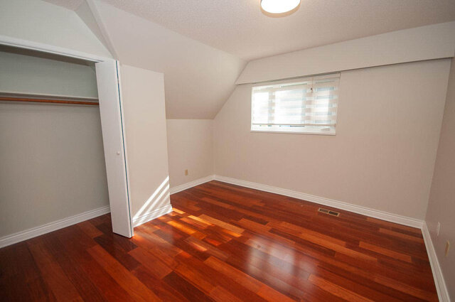 Bright bedroom with rich hardwood floors and built-in closet. - 5367 Esperanza Drive, North Vancouver