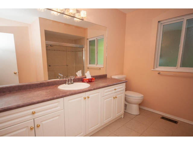 Spacious bathroom with granite countertops and a large vanity. - 315 Stevens Dr, West Vancouver