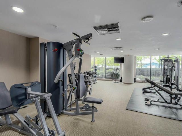 Bright and spacious gym with modern equipment and large windows. - 2702 - 918 Cooperage Way, Vancouver Downtown