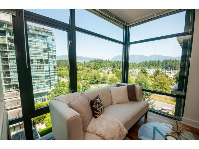 Furnished living room with large windows, city view, and cozy seating. - 703 - 1863 Alberni Street, Vancouver Downtown
