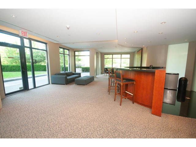 Furnished living room with large windows, modern furniture, and a view of greenery outside. - 703 - 1863 Alberni Street, Vancouver Downtown