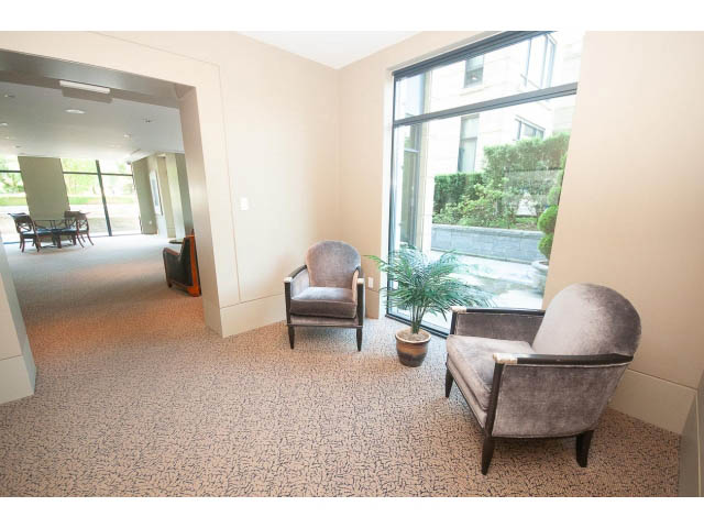 Spacious living room with large windows and modern furniture. - 703 - 1863 Alberni Street, Vancouver Downtown