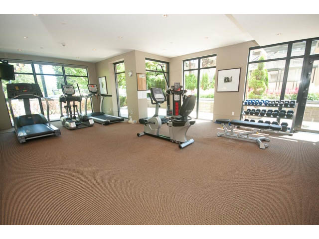 Spacious fitness room with cardio machines and large windows. - 703 - 1863 Alberni Street, Vancouver Downtown