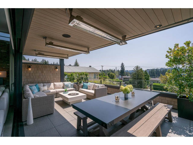 Furnished patio with outdoor seating and city view. - Address WITHHELD, West Vancouver
