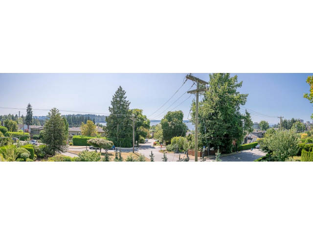 Bright living room with city view and lush greenery. - Address WITHHELD, West Vancouver
