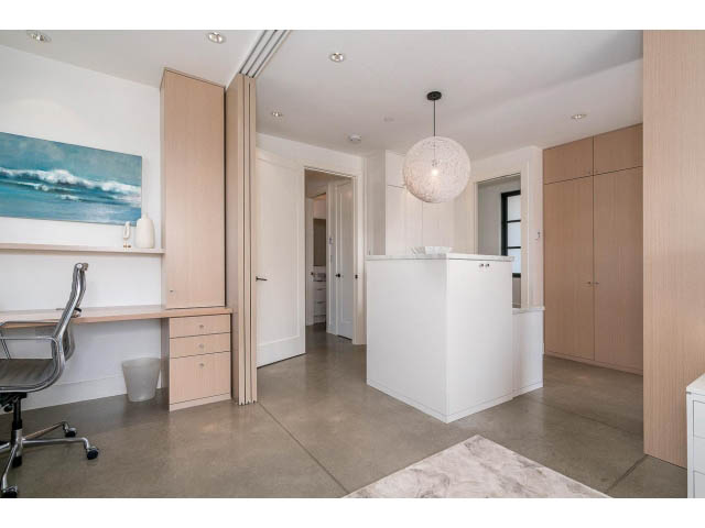 Bright kitchen with white cabinets, marble countertops, and a modern pendant light. - Address WITHHELD, West Vancouver