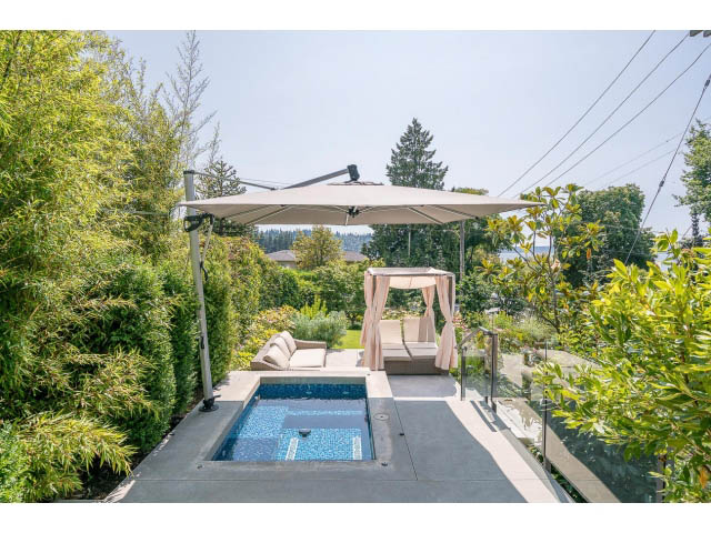 Furnished patio with a small pool, outdoor seating, and a large umbrella. - Address WITHHELD, West Vancouver