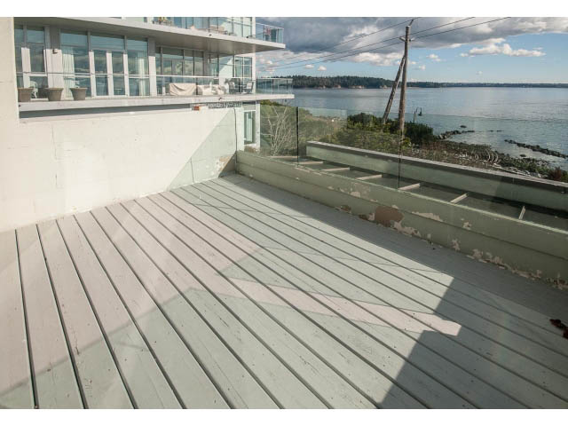 Furnished balcony with wooden deck and city view. - 2150 Argyle Ave., West Vancouver