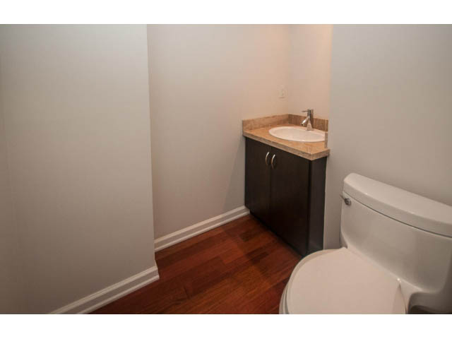 Bathroom with hardwood floors and a granite countertop. - 2150 Argyle Ave., West Vancouver