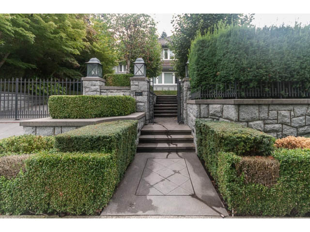 Furnished entryway with stone walls and neatly trimmed hedges. - 5630 Angus Dr., Vancouver West Side