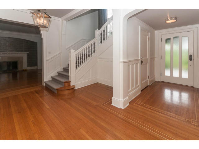 Furnished living room with hardwood floors and white wainscoting. - 5630 Angus Dr., Vancouver West Side