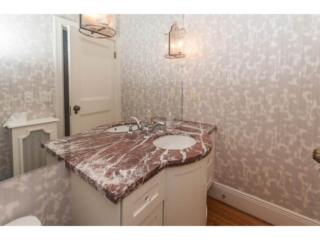 Bathroom with marble countertops and patterned wallpaper. - 5630 Angus Dr., Vancouver West Side
