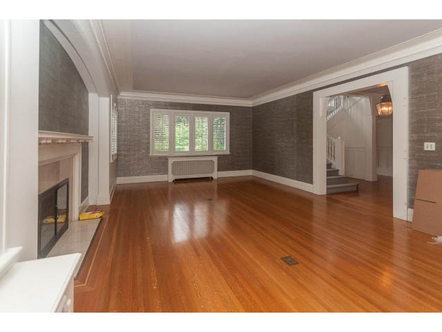Spacious living room with hardwood floors and large windows. - 5630 Angus Dr., Vancouver West Side