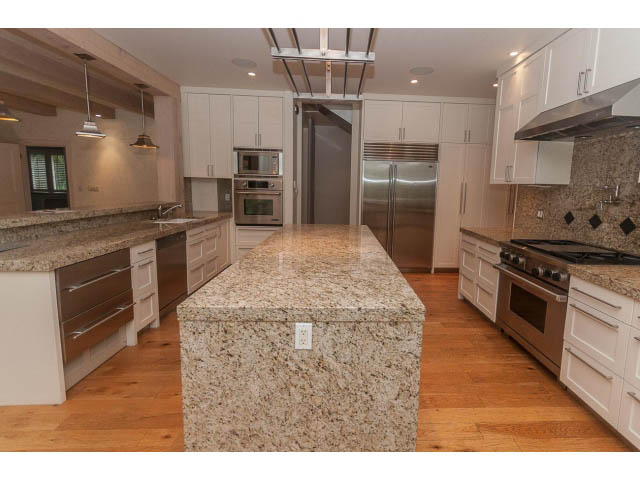 Bright kitchen with granite countertops, hardwood floors, and stainless steel appliances. - 5630 Angus Dr., Vancouver West Side