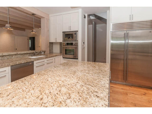 Bright kitchen with granite countertops, stainless steel appliances, and hardwood floors. - 5630 Angus Dr., Vancouver West Side