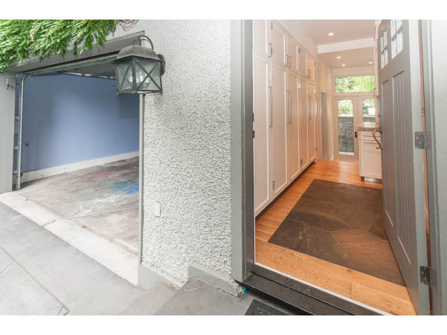 Bright entryway with hardwood floors and a modern light fixture. - 5630 Angus Dr., Vancouver West Side
