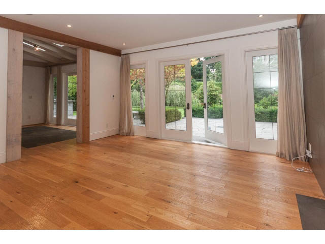 Bright living room with hardwood floors and French doors leading to a garden. - 5630 Angus Dr., Vancouver West Side