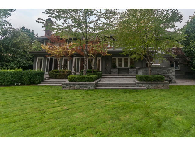 Spacious 6-bedroom + den house with a large, well-maintained lawn and stone steps leading to the front door. - 5630 Angus Dr., Vancouver West Side