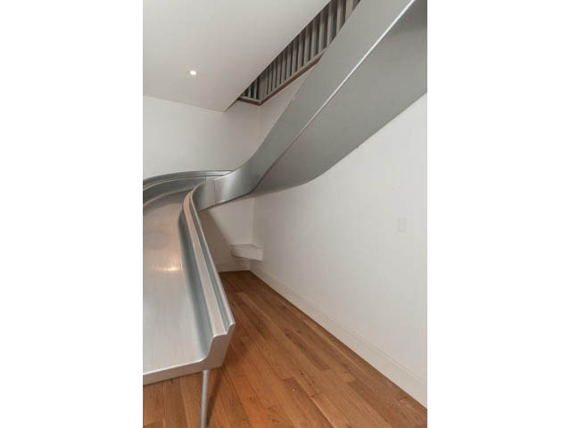 Modern staircase with sleek design and hardwood floors. - 5630 Angus Dr., Vancouver West Side