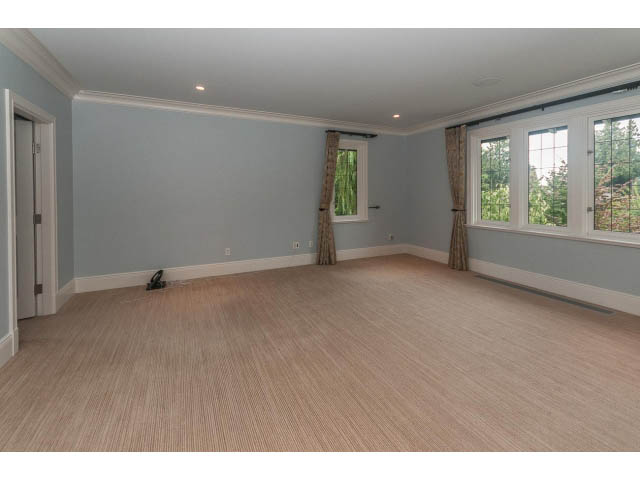 Spacious living room with hardwood floors and large windows. - 5630 Angus Dr., Vancouver West Side
