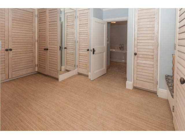 Furnished bedroom with hardwood floors and closet doors. - 5630 Angus Dr., Vancouver West Side