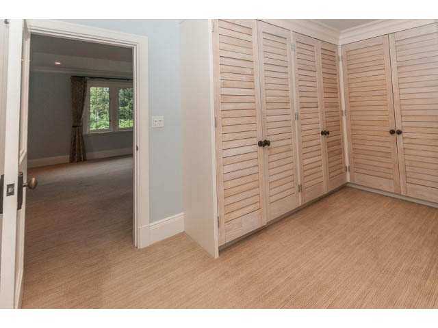 Spacious walk-in closet with wooden shutters and hardwood floors. - 5630 Angus Dr., Vancouver West Side