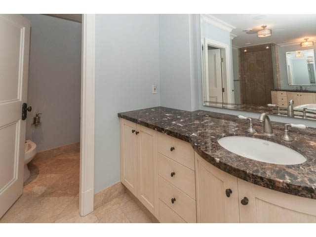 Spacious bathroom with granite countertops and light wood cabinets. - 5630 Angus Dr., Vancouver West Side