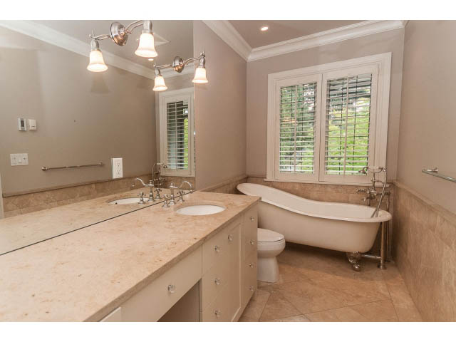 Spacious bathroom with marble countertops and large windows. - 5630 Angus Dr., Vancouver West Side
