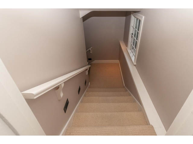 Staircase leading to upper level with carpeted steps and white walls. - 5630 Angus Dr., Vancouver West Side