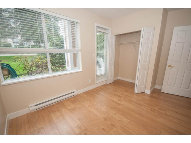 Bright den with hardwood floors, large windows, and built-in closet. - 202 - 3629 Deercrest, North Vancouver